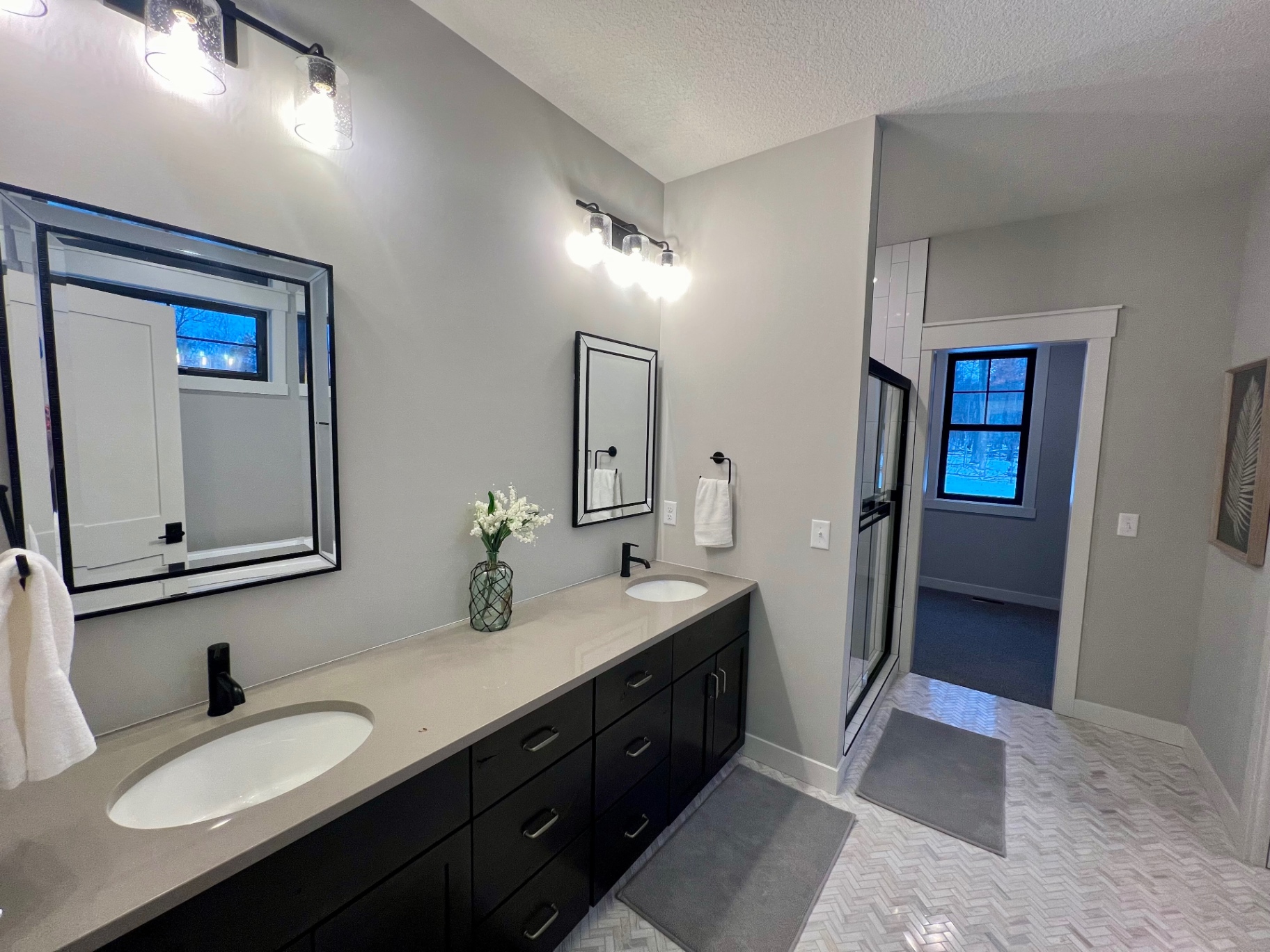 Freestanding soaking tub beside the window.