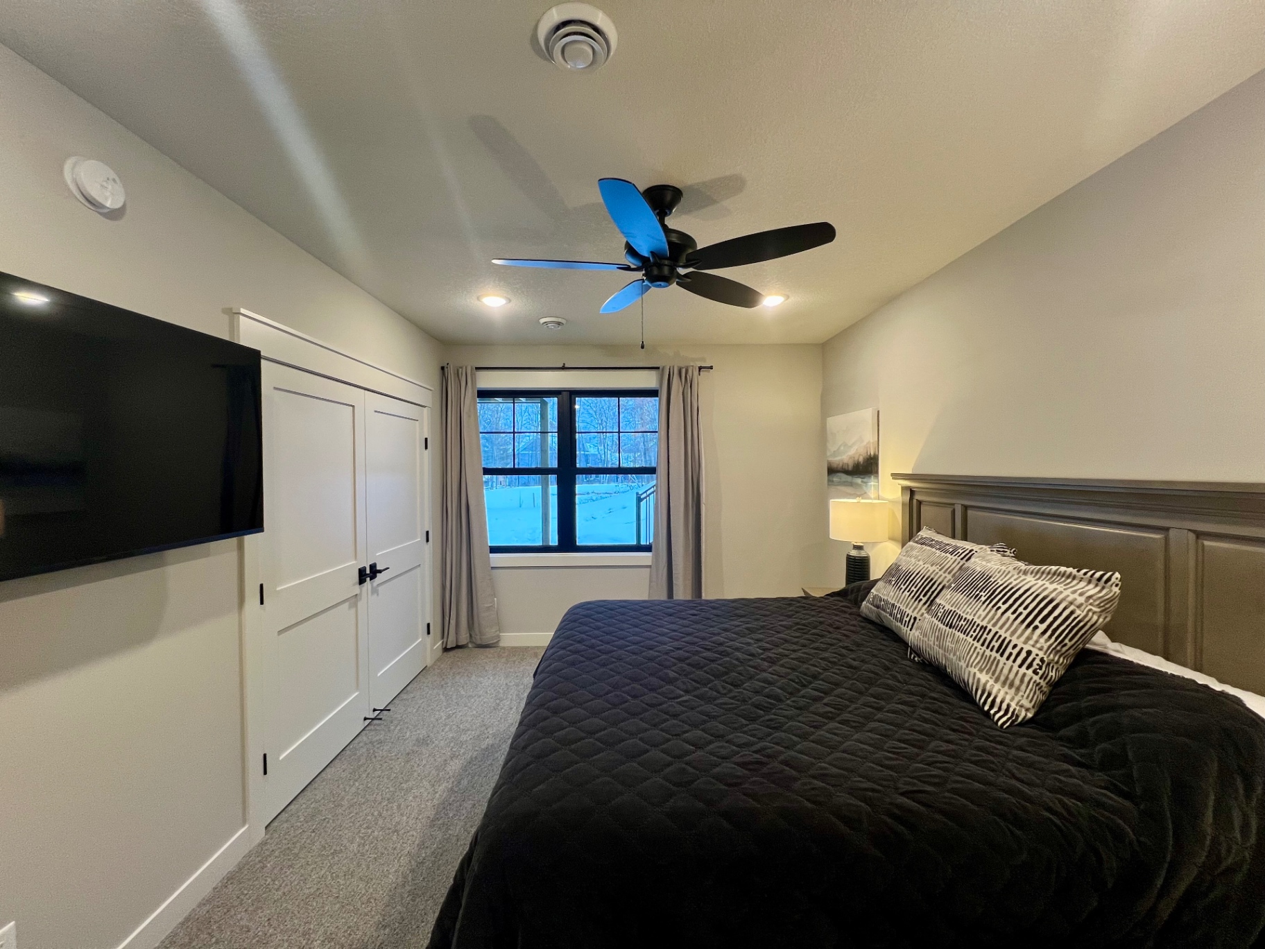 Quiet guest room facing the pines.