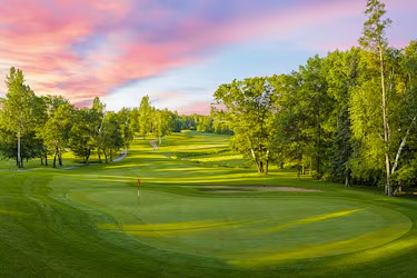 The Pines at Grand View Lodge — fairway at sunset with pink sky