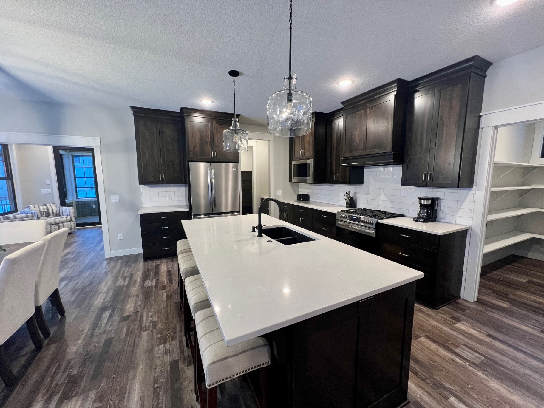 Kitchen flowing into the dining and sunroom — the heart of Casa Italia.
