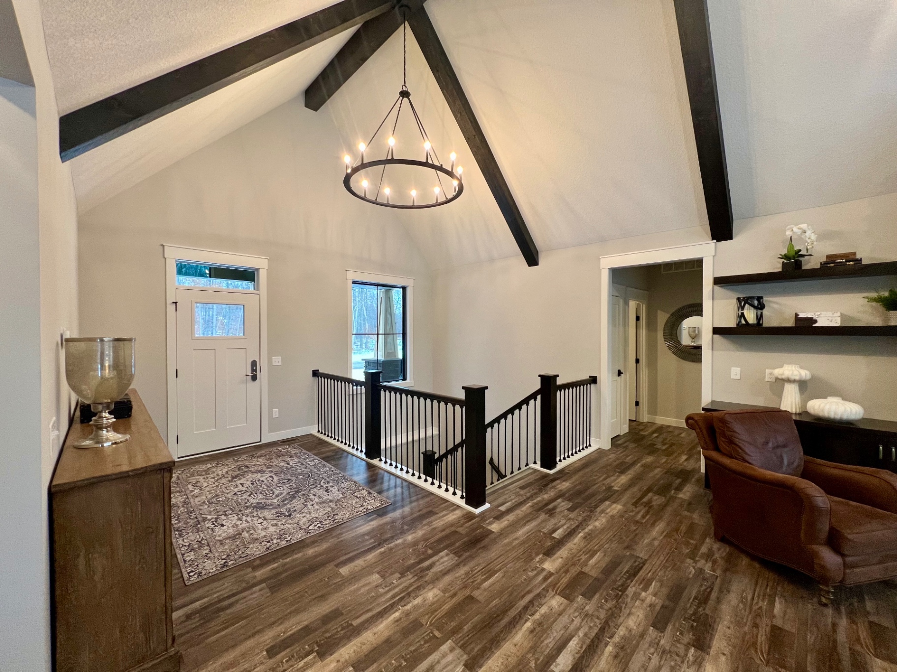 Open landing with leather club chair and built-in shelving.