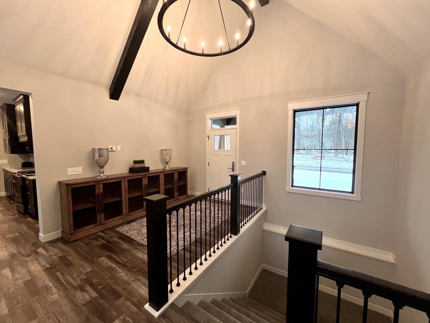 Looking from the kitchen toward the entry and stair down.